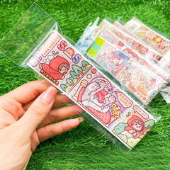 Close up of a decorative sticker roll with colorful cartoon style artwork for journals, planners, and scrapbooking