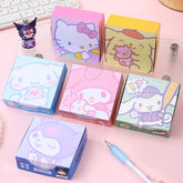 Pastel decorative memo note pads displayed with a blue stationery pen