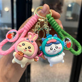 Pink and green dessert character keychains with braided straps and colorful details