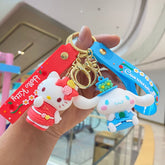 Red and blue doll keychains with floral straps and metal rings