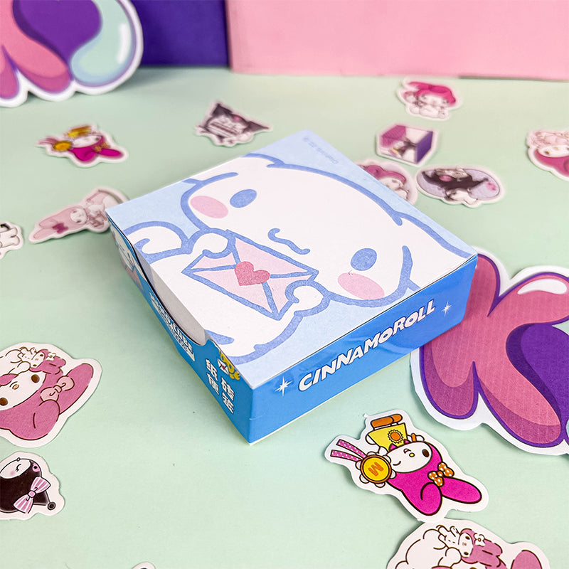 Blue memo cube with a simple pastel cartoon illustration
