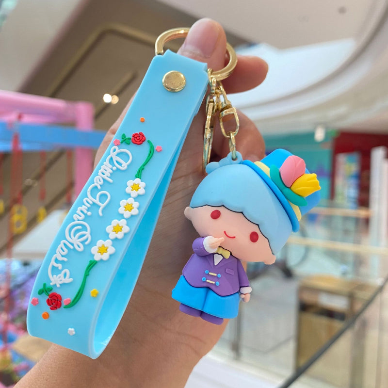 Blue floral doll keychain with decorative strap and metal ring