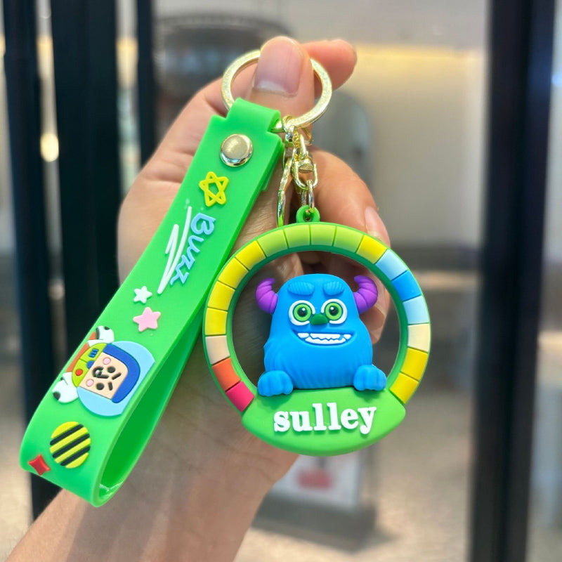 Blue monster rubber pendant keychain with green strap and colorful round frame