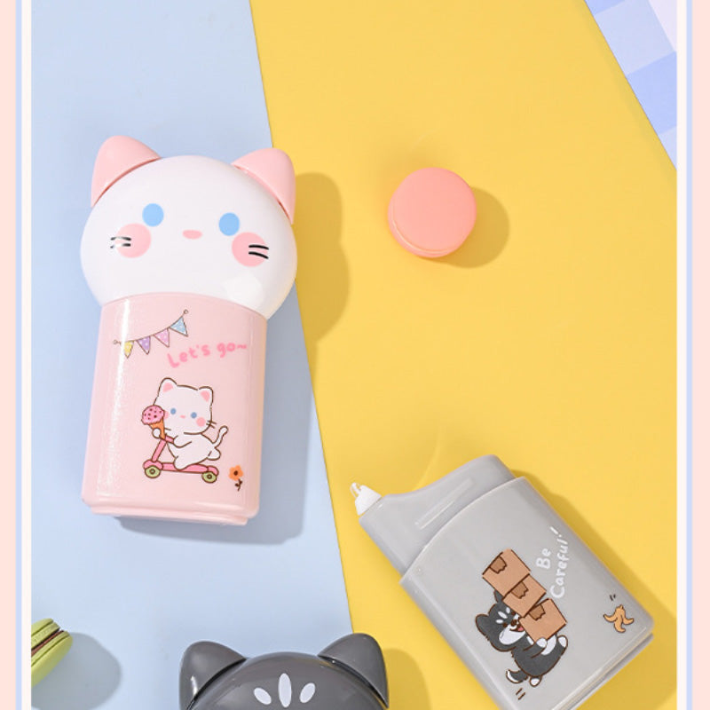 Pink cat correction tape dispenser with the cap removed