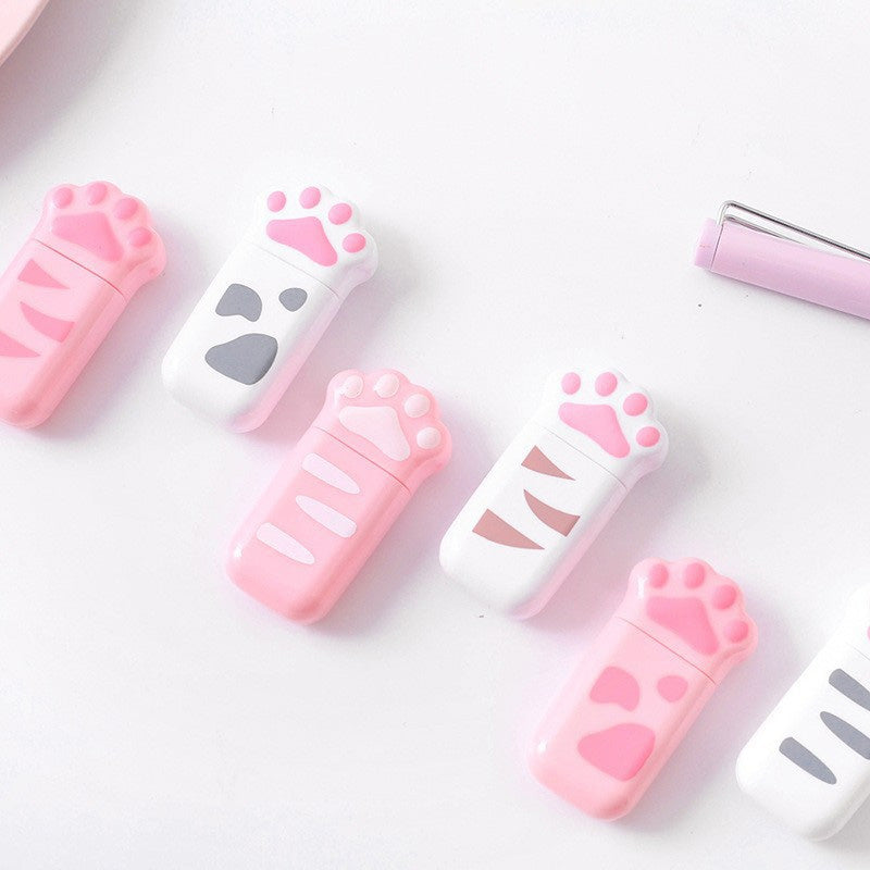 Pink and white cat paw correction tape dispensers in different designs