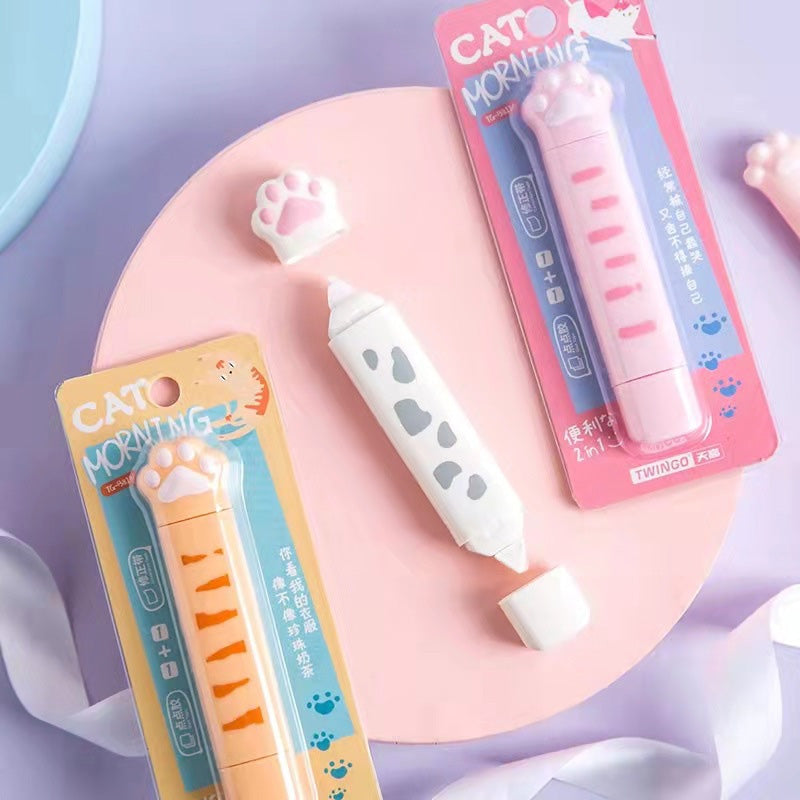 Pink and yellow cat paw correction tape dispensers in retail packaging