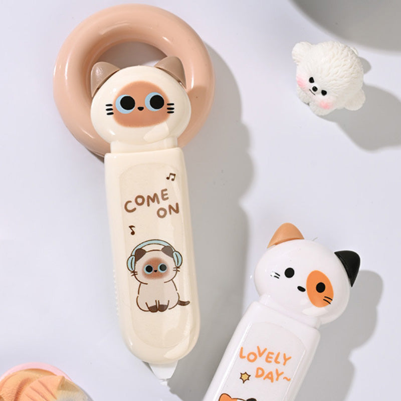Cat-themed correction tape dispenser with a pastel character design