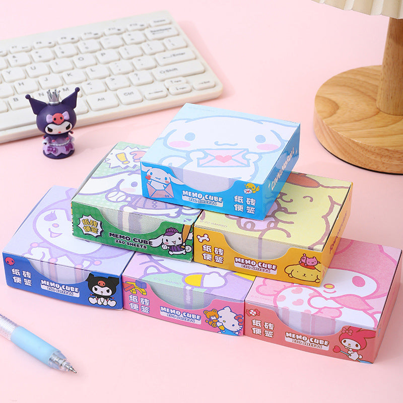 Colorful cartoon memo cubes arranged in a stationery collection
