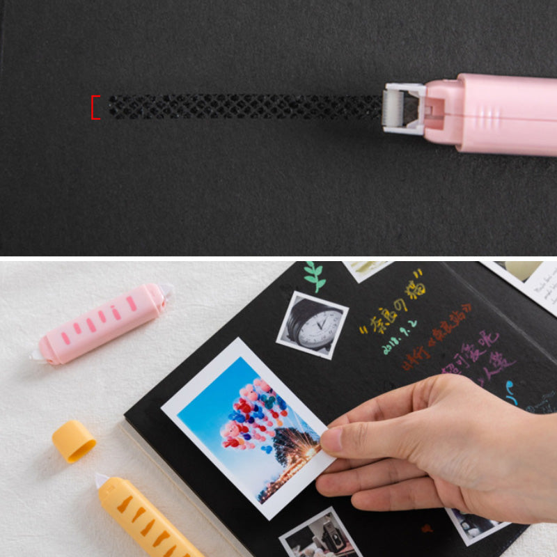 Pink correction tape applying a dark correction strip to paper