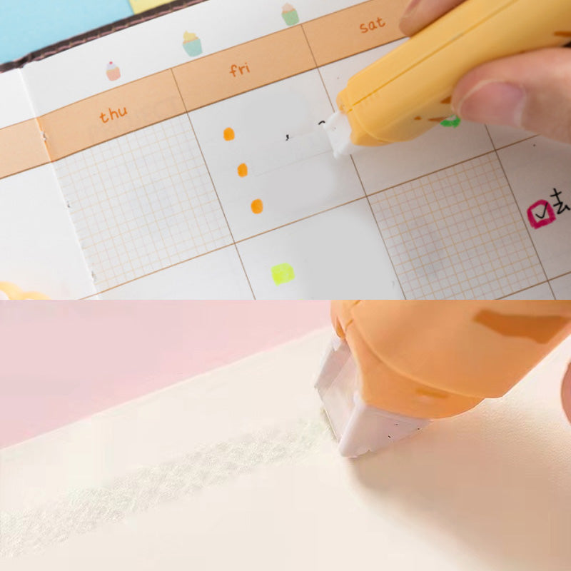 Yellow correction tape being applied to a notebook page