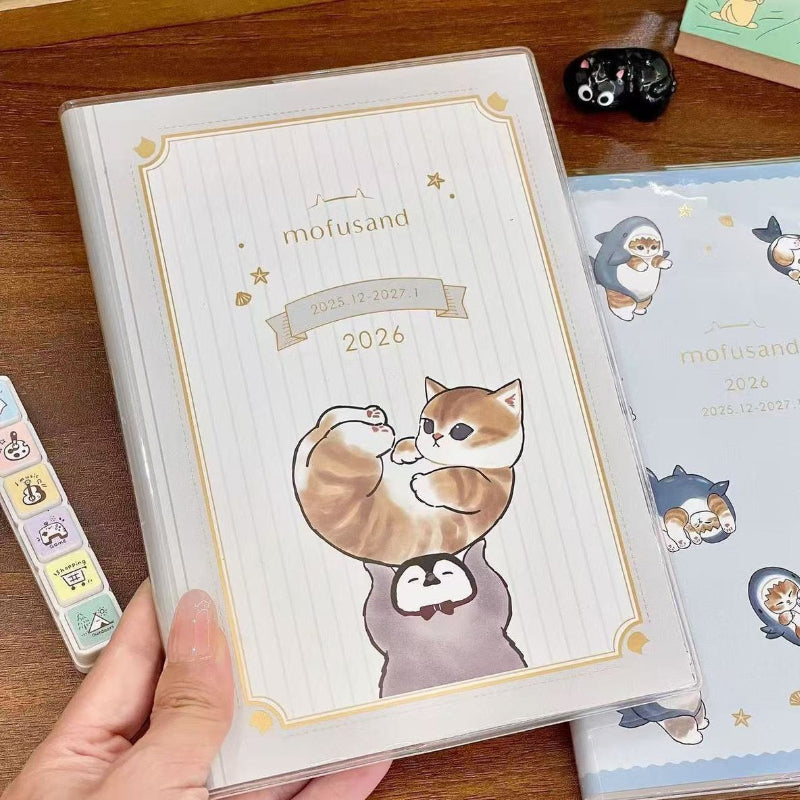 Hand holding a cute B6 weekly planner with a premium protective cover and pastel artwork