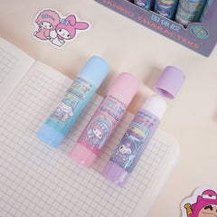 Cute cartoon glue sticks placed on notebook