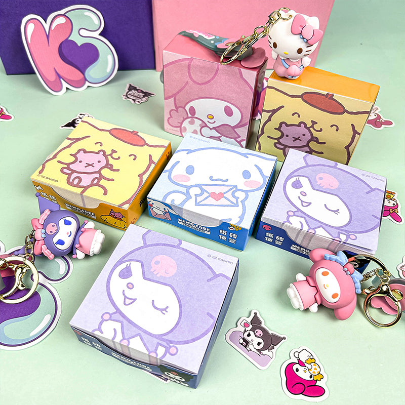Cute cartoon memo note pads arranged with colorful stationery accessories