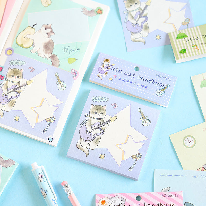 Cute cat guitar notebook with matching stationery on blue background