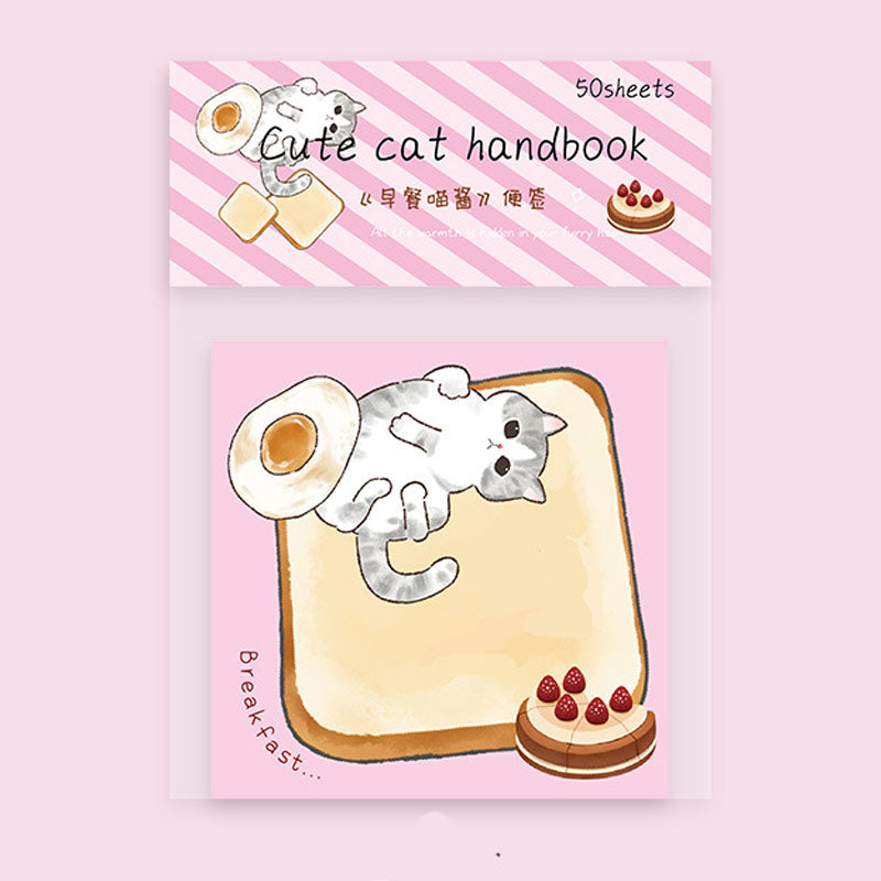Pink cat message notebook featuring breakfast toast and a playful kitten