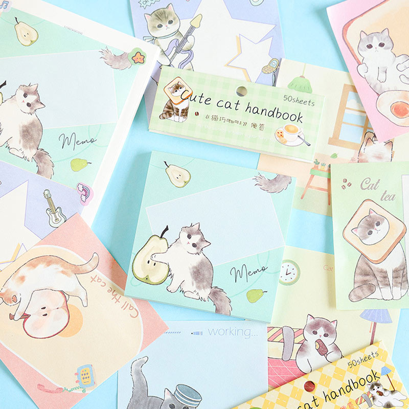 Cute cat message notebooks displayed in pastel cartoon designs