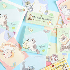 Cute cat message notebooks displayed in pastel cartoon designs
