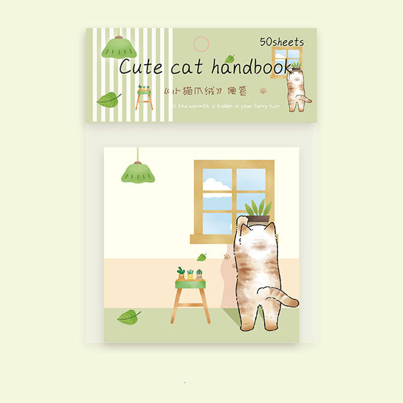 Green cat message notebook with kitten, window, plants, and home scene