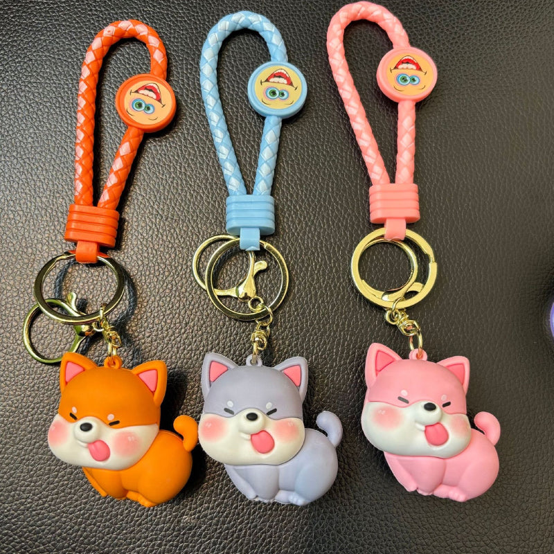 Cute dog PVC keychain color set featuring orange, blue, and pink designs