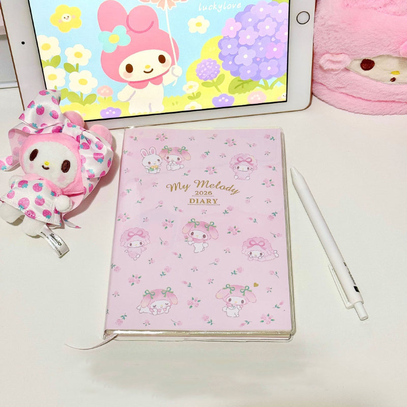 Cute rabbit themed weekly planner displayed on a desk with matching stationery accessories