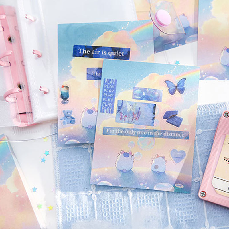 Dreamy bunny notebook decorated with pastel stickers, quotes, and rainbow artwork