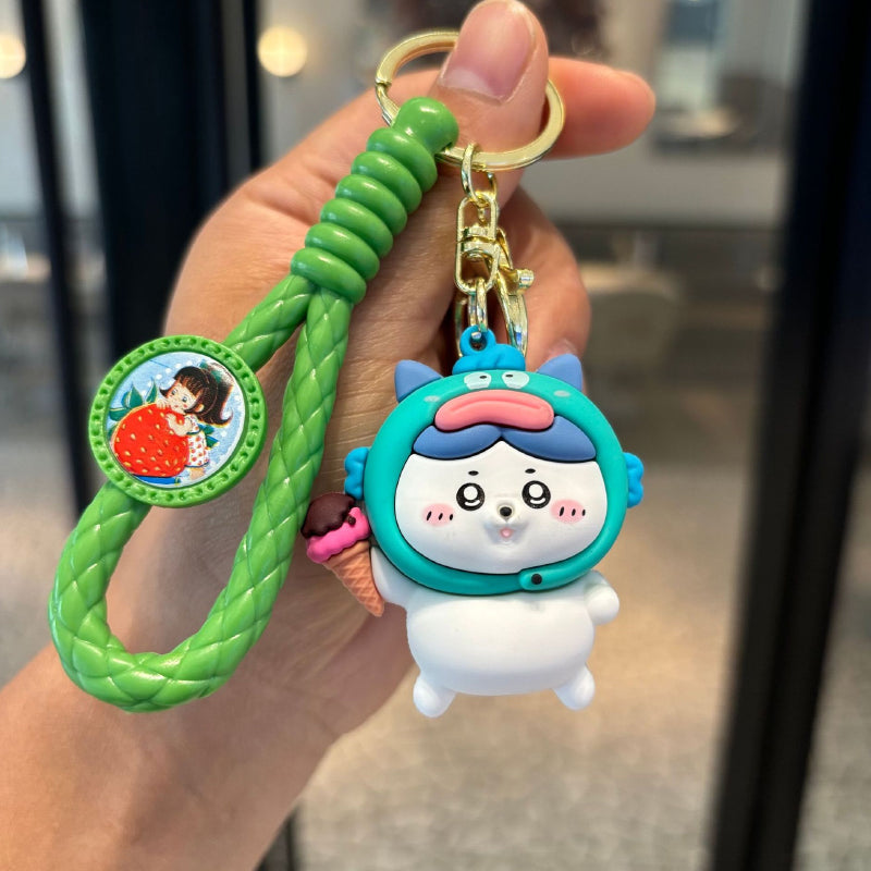 Green dessert pet character keychain with braided strap and gold-tone ring