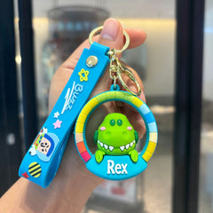Green dinosaur cartoon rubber pendant keychain with blue frame and matching strap