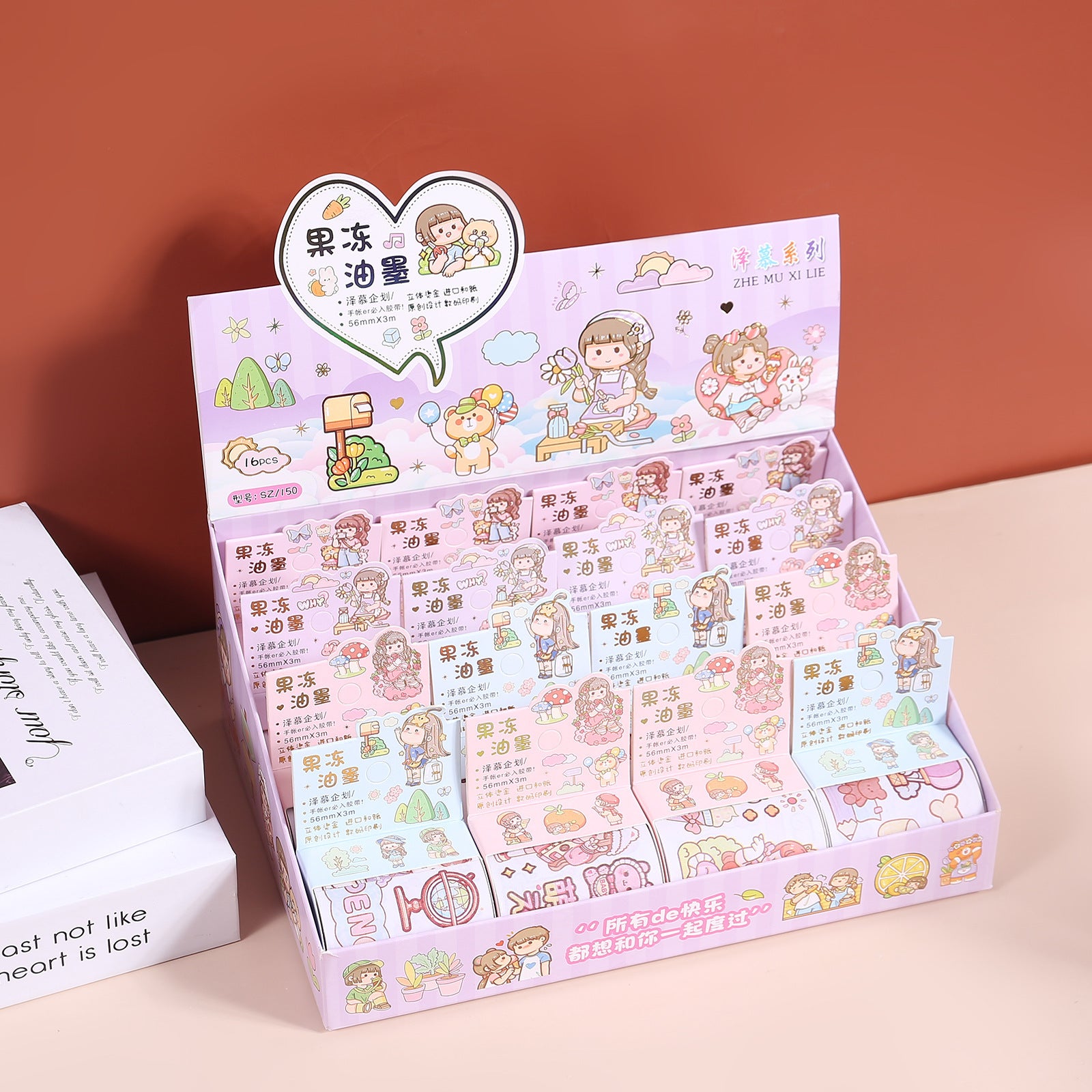 Display box filled with assorted jelly ink tape sticker rolls featuring pastel decorative themes for planners and paper crafts