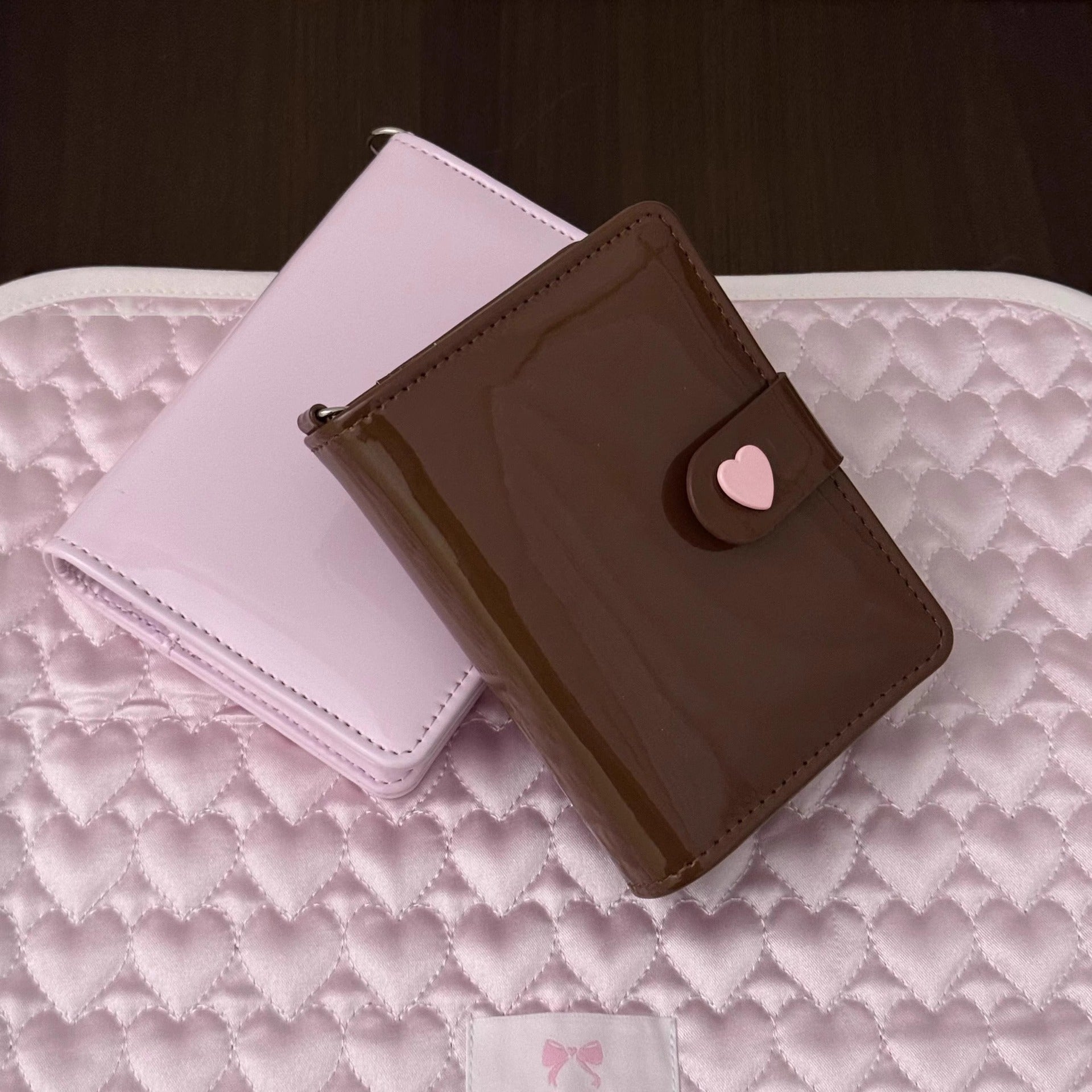 M5 chocolate brown PU loose-leaf planner with pink heart clasp on a pink quilted background