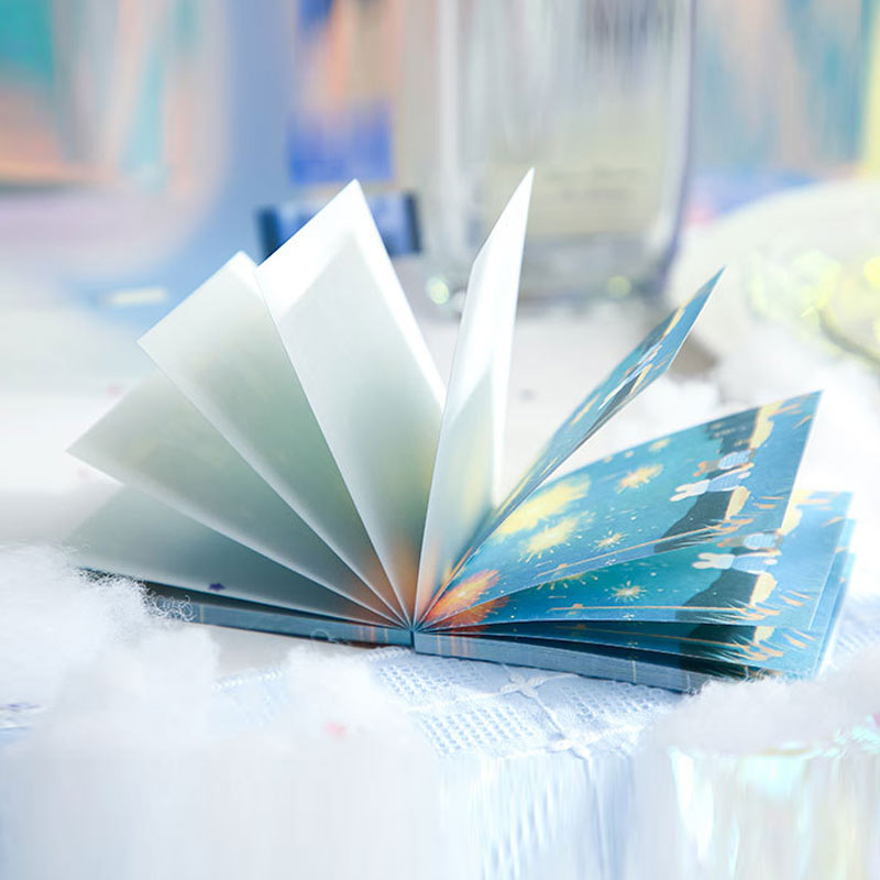 Open fantasy bunny notebook showing blank pages and illustrated cover