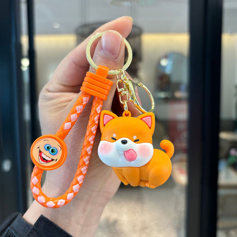 Orange cute dog PVC keychain with braided strap and gold-tone ring