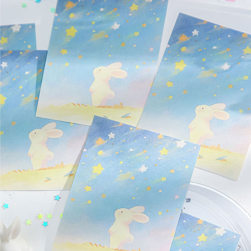 Pastel bunny note paper with stars and soft blue sky artwork