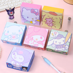 Pastel decorative memo note pads displayed with a blue stationery pen