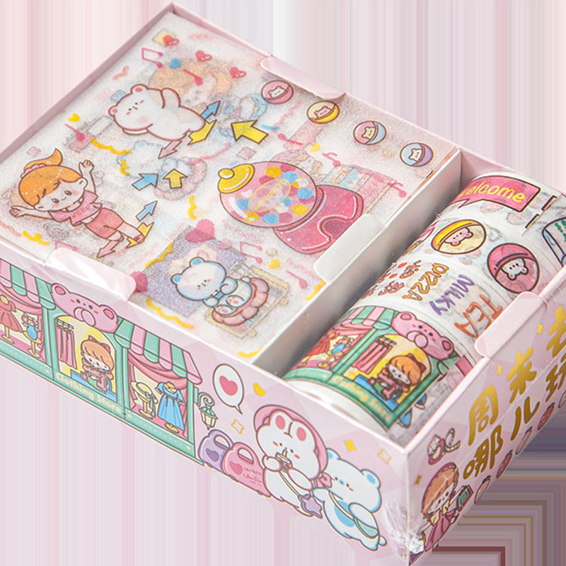 Open pastel washi tape box featuring playful cartoon scenes and illustrated tape rolls