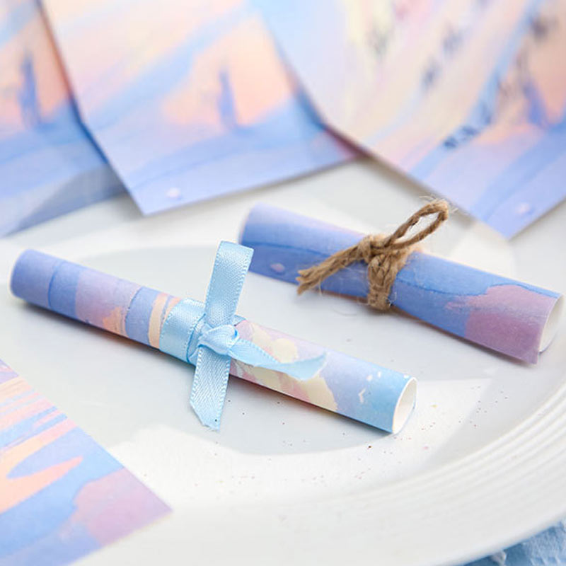 Rolled pastel note paper with dreamy cloud and sky artwork