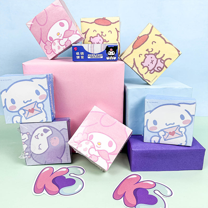 Pastel memo cubes displayed with cute decorative stationery