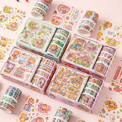 Multiple pastel washi tape boxes with fairy characters, flowers, and colorful cartoon scenes