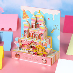 Pink 3D cake castle note pad with layered paper design on a desktop
