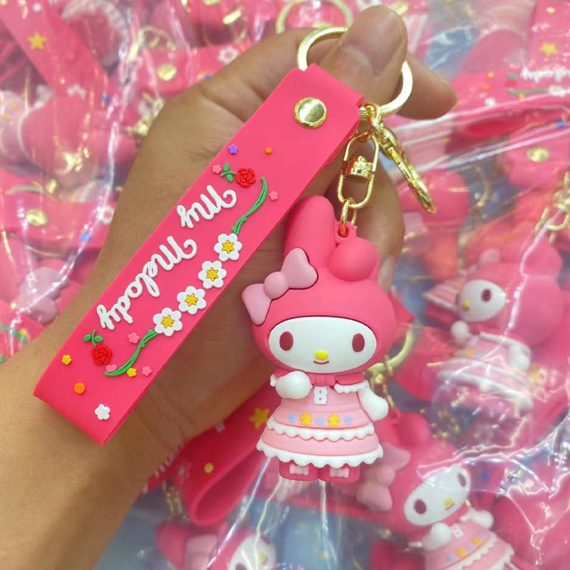 Pink bunny-style doll keychain with floral outfit details