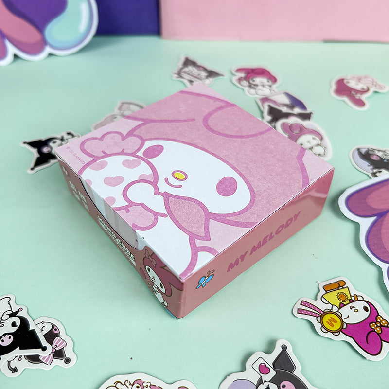 Pink decorative memo cube with playful cartoon design