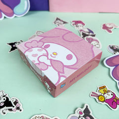 Pink decorative memo cube with playful cartoon design