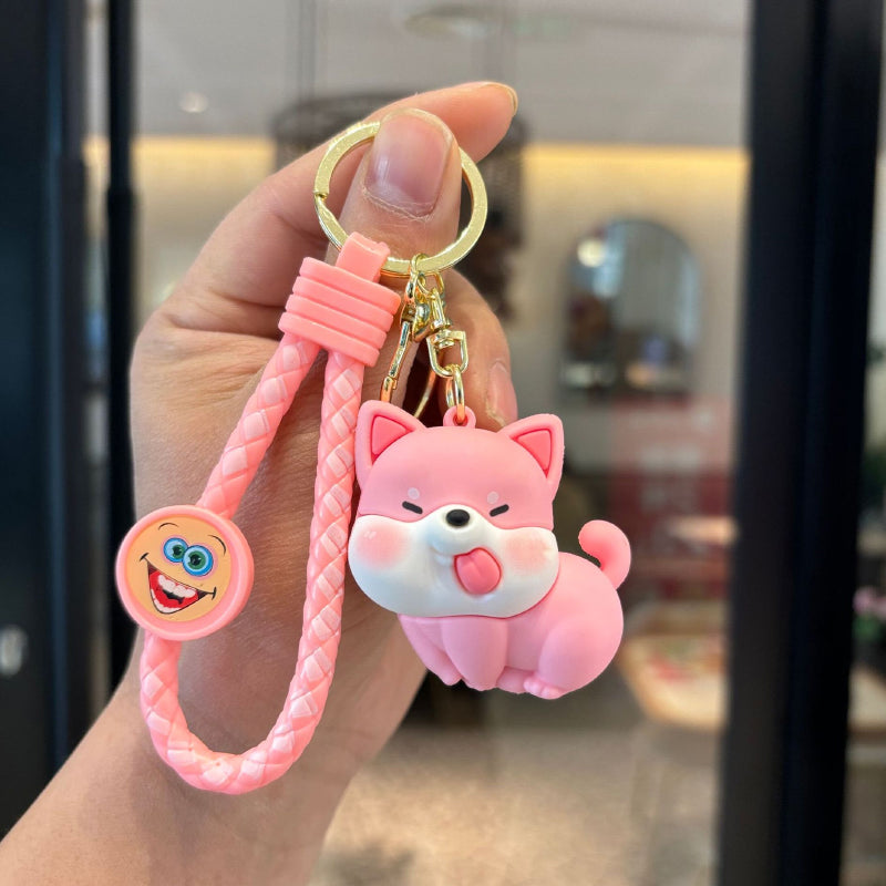 Pink cute dog PVC keychain with braided strap and gold-tone ring