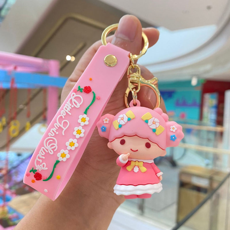 Pink floral 3D doll keychain with decorative pastel details