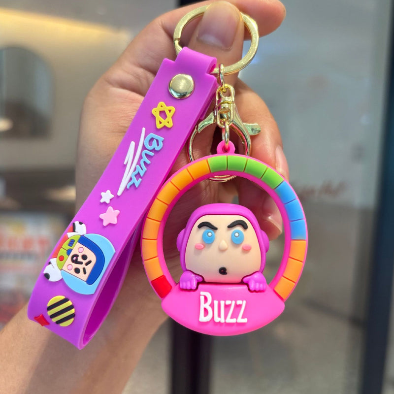 Pink space character rubber pendant keychain with rainbow frame and matching strap