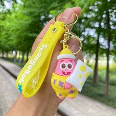 Pink and yellow character keychain with soft rubber pendant and metal ring