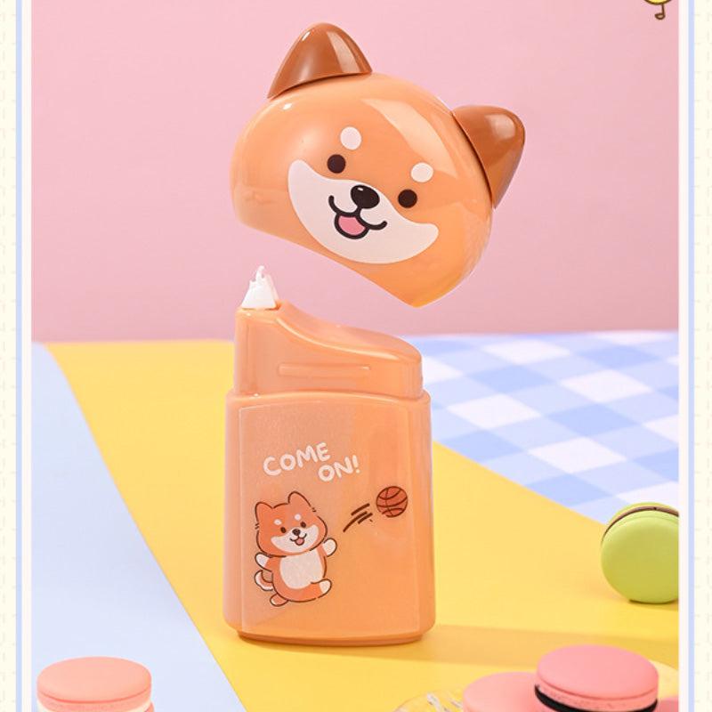Orange puppy design correction tape dispenser with the cap removed