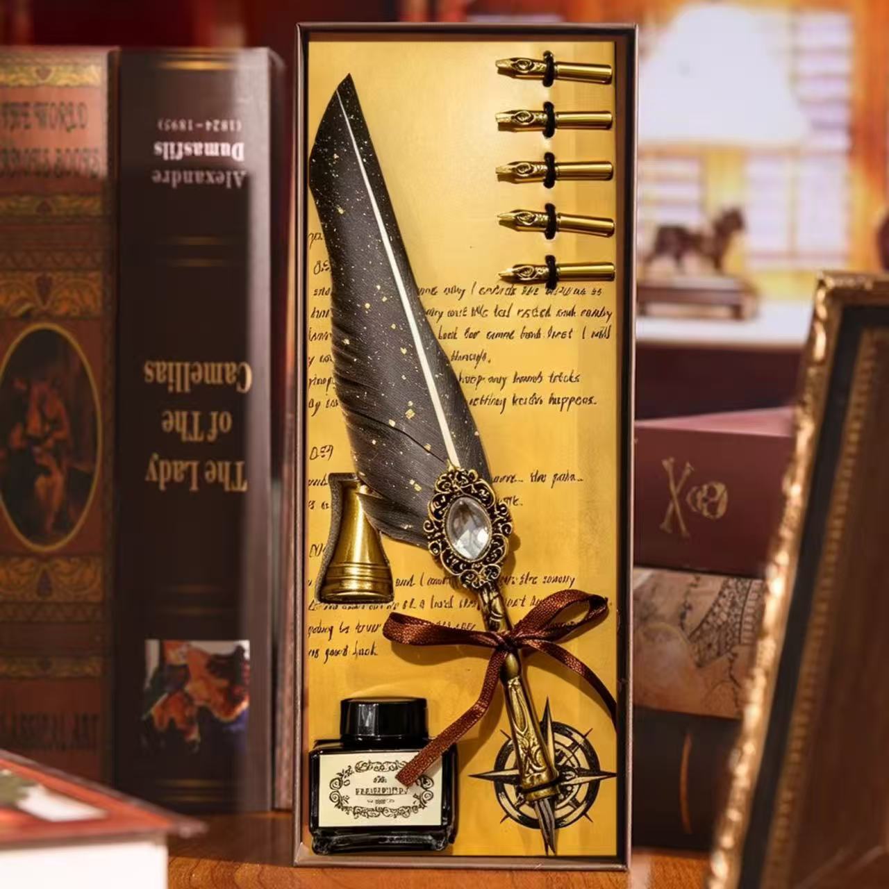 Black feather quill pen set with interchangeable nibs and ink bottle