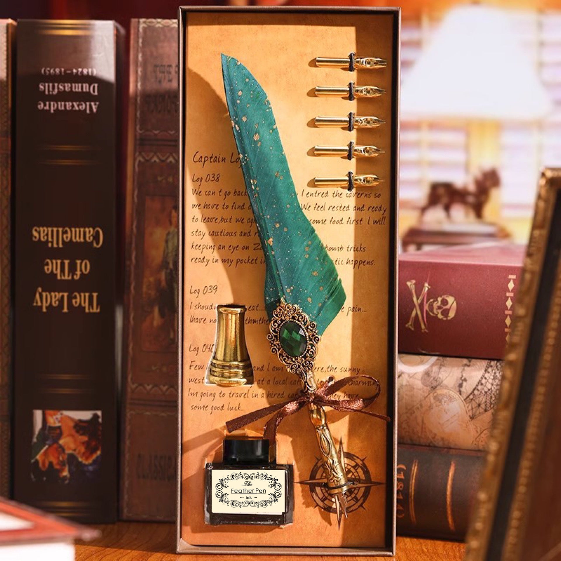 Green feather quill pen set with gold nibs and decorative holder