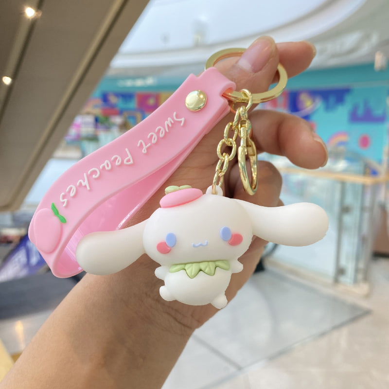 White bunny keychain with pink decorative strap