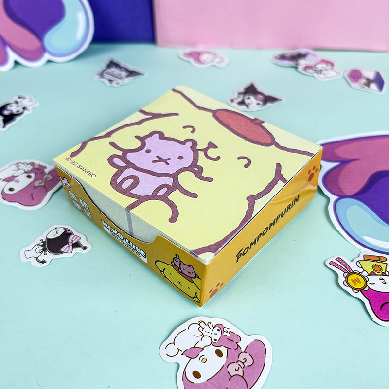 Yellow decorative memo cube with playful cartoon artwork